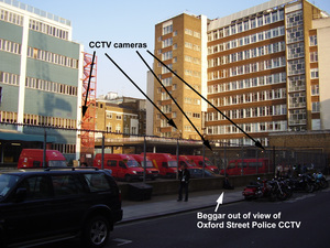 Post_Office_vans_with_street_beggar_outside_of_CCTV_field_of_view.jpg